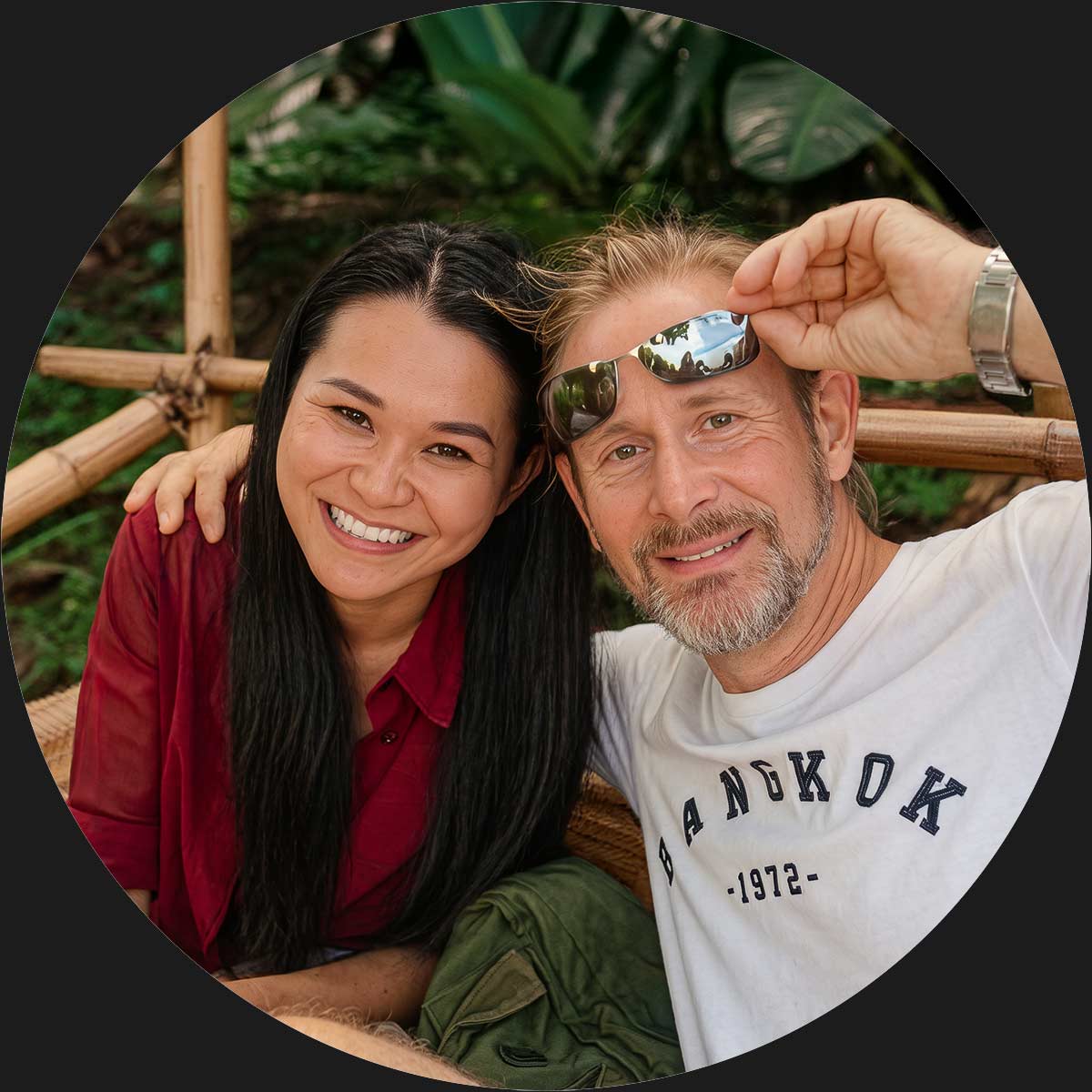 Matthias and Saruta Madritsch, founders of Lalanna Design, smiling together outdoors in a tropical bamboo setting.